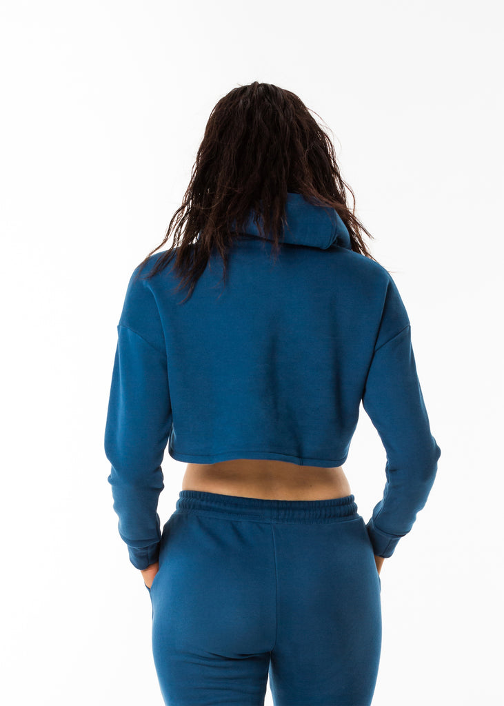 Streetwear online nz, Gynetique identity cropped hoodie in blue, long sleeves, brushed fleece fabric, dropped shoulder, ribbed cuffs, size small