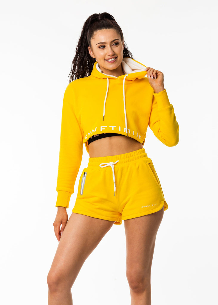 Women's activewear online, cropped hoodie in sunflower bright yellow, lined hood, white drawstring, gynetique logo front, full sleeve