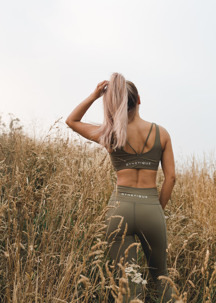 Women's gym wear brand NZ, Gynetique Intense collection khaki colour padded sports bra and leggings outfit, Christchurch port hill background