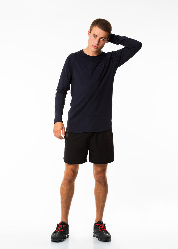 Men's sportswear online nz, long sleeve training top in dark blue, curved bottom hem with extra length, round neck, gyneitque logo on front