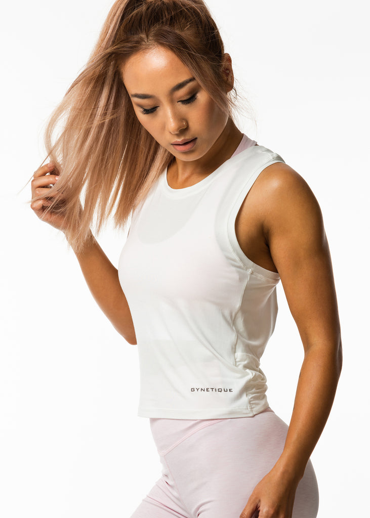 Women's workout clothes nz, white gym tank top, round neck, gynetique logo front, relaxed fit style