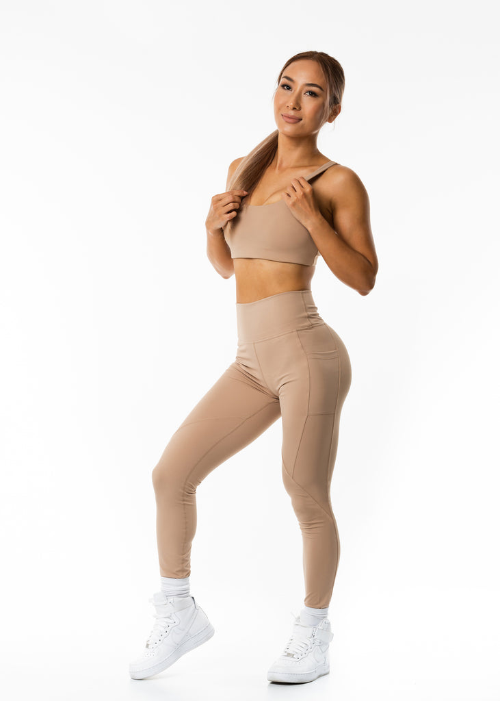 Women's gym wear brand online, Gynetique Intense collection beige sunset blush padded sports bra, round scoop neck, elastic waist band, wide shoulder strap