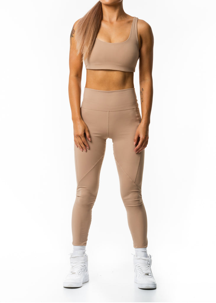 Women's sports clothing nz, Gynetique Intense beige colour sunset blush sports bra, removable pads, elastic waist band, wide shoulder straps, round scoop neck line